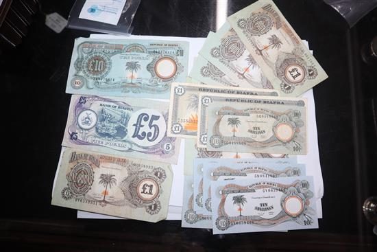 A collection of African and Egyptian currency, including Bank of Biafra banknotes,